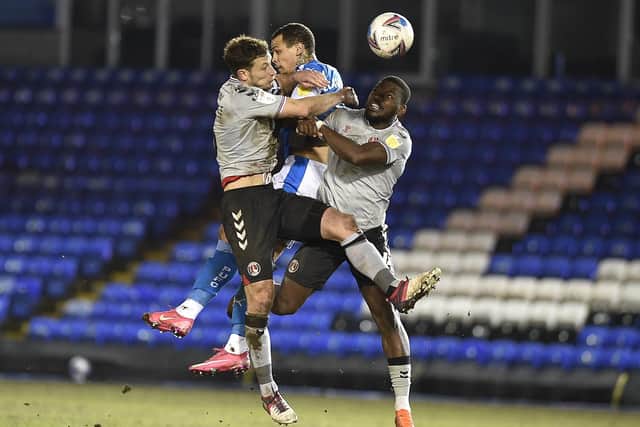 Posh striker Jonson Clarke-Harris is the meat in a Charlton Athletic sandwich. Photo: David Lowndes.