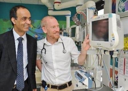 Cllr Farooq and Dr Tim Jones with the new Cardiac Echo machine at Peterborough City Hospital in 2018.