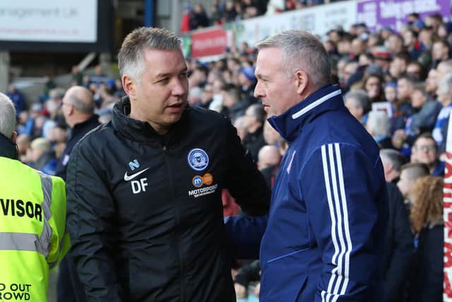 Rival managers Darren Ferguson (left) and Paul Lambert.
