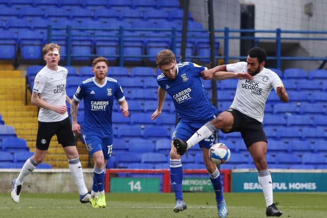 Nathan Thompson of Peterborough United battles with Aaron Drinan of Ipswich Town. Photo: Joe Dent/theposh.com.
