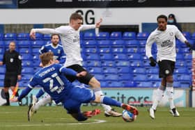 Jack Taylor of Peterborough United is tackled by Flynn Downes of Ipswich Town. Photo: Joe Dent/theposh.com.