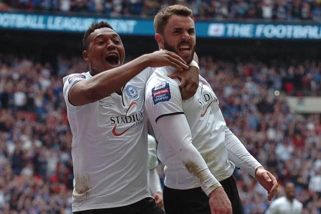 Josh McQuoid celebrates his goal for Posh at Wembley in the 2014 JPT Trophy Final with Britt Assombalonga.