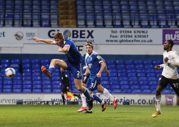 Mark McGuinness of Ipswich Town scores an own goal to hand victory to Posh. Photo: Joe Dent/theposh.com.