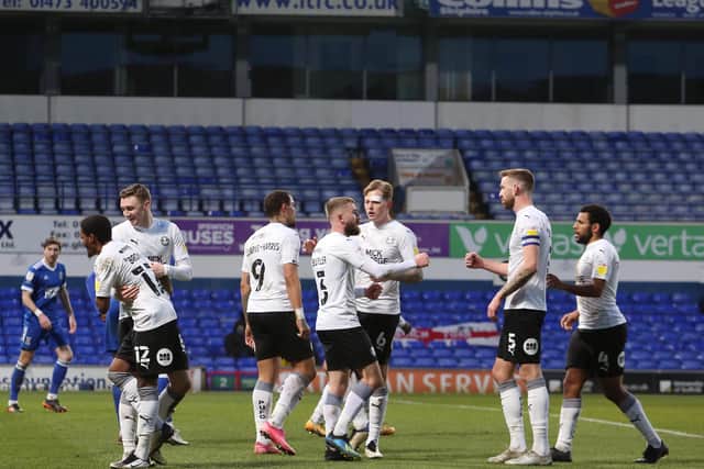Posh players celebrate the only goal of the game at Ipswich Town. Photo: Joe Dent/theposh.com.