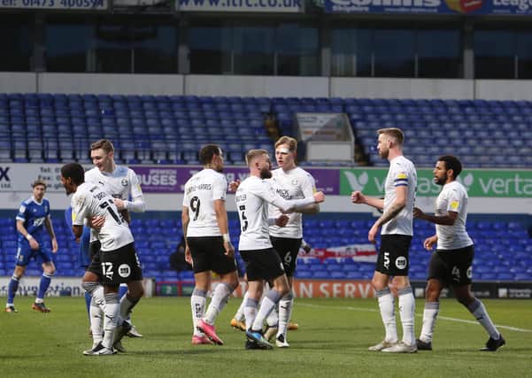 Posh players celebrate the only goal of the game at Ipswich Town. Photo: Joe Dent/theposh.com.