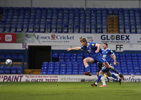 The only goal of the game between Ipswich and Posh is scored into his own net by home defender Mark McGuinness. Photo: Joe Dent/theposh.com.