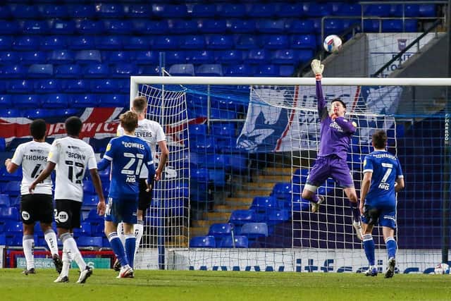 Posh goalkeeper Christy Pym tips a shot from Ipswich substitute Jon Nolan over the crossbar. Photo: Joe Dent/theposh.com.