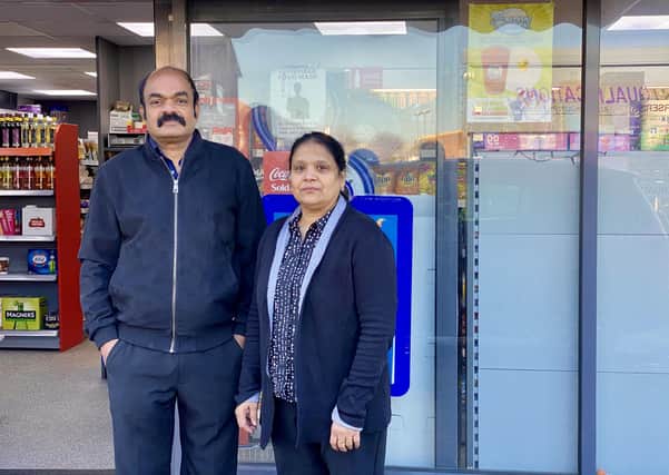 Ravi and Githa outside their P&P Lodge store.