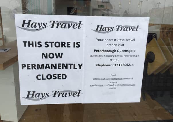 A closure notice on the doors of Hays Travel in the Serpentine Green shopping centre in Hampton.