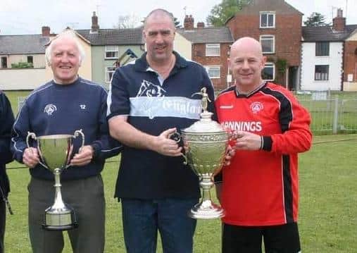 Peterborough Sports officials with the Peterborough Premier Division Trophy and Northants Junior Cup in 2007. From left Colin Day, Tommy Flynn and Al Lenihan.