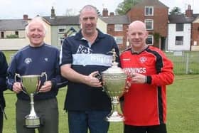 Peterborough Sports officials with the Peterborough Premier Division Trophy and Northants Junior Cup in 2007. From left Colin Day, Tommy Flynn and Al Lenihan.