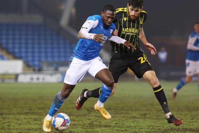 Idris Kanu of Peterborough United in action with Jack Baldwin of Bristol Rovers. Photo: Joe Dent/theposh.com.