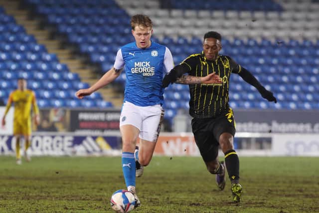 Frankie Kent of Peterborough United in action with Brandon Hanlan of Bristol Rovers. Photo: Joe Dent/theposh.com.