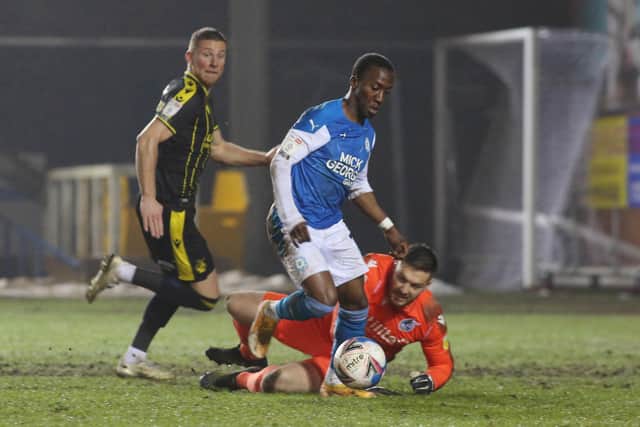Posh star Siriki Dembele takes the ball past Rovers' goalkeeper Joe Day, but he couldn't score. Photo: Joe Dent/theposh.com.