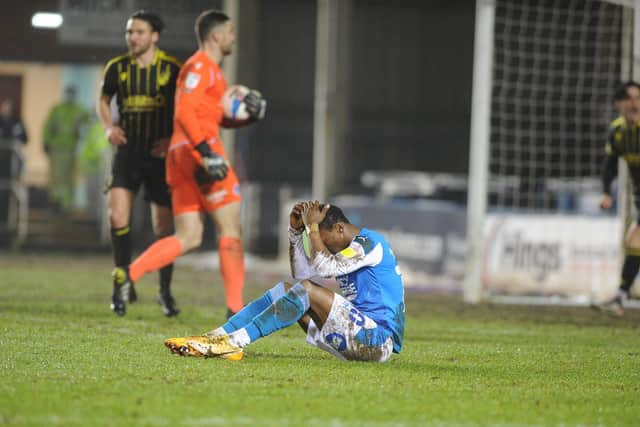 Posh star Siriki Dembele has his head in his hands after failing to convert a great chance against Bristol Rovers. Photo: David Lowndes.