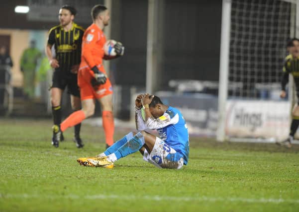 Posh star Siriki Dembele has his head in his hands after failing to convert a great chance against Bristol Rovers. Photo: David Lowndes.