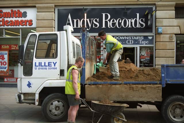 Workmen outside the first Peterborough Andy Record store in Lower Bridge Street.