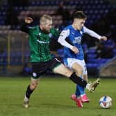 Flynn Clarke (blue shirt) in action for Posh against Rochdale in a League One game this season.