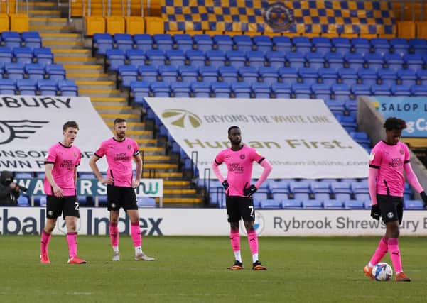 Peterborough United players are dejected after conceding the second goal of the game at Shrewsbury. Photo: Joe Dent/theposh.com.
