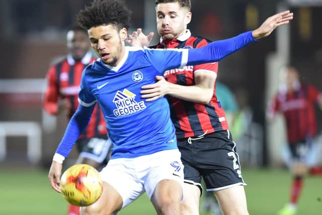 Lee Angol in action for Posh.