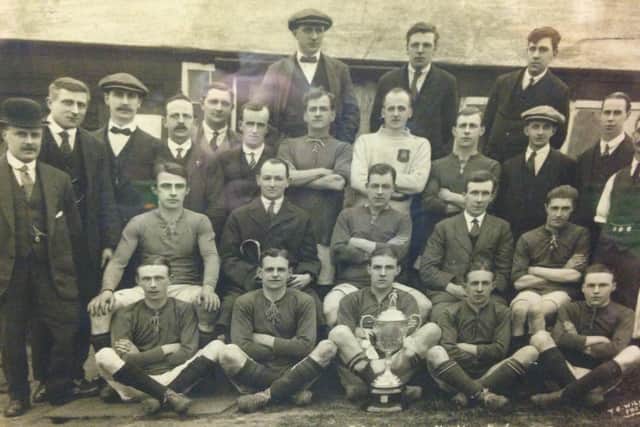 Brotherhood Works FC  with the 1919-20 Northants League trophy.