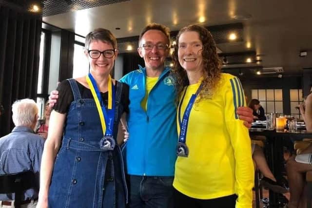 Gina Crane, Hugh Burton, and Ros Loutit after 2019 Boston (USA) Marathon.