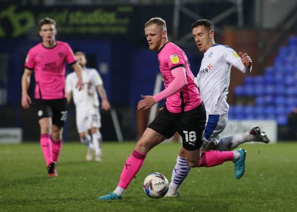 Frazer Blake-Tracy of Peterborough United in action with Kieron Morris of Tranmere Rovers. Photo: Joe Dent/theposh.com.