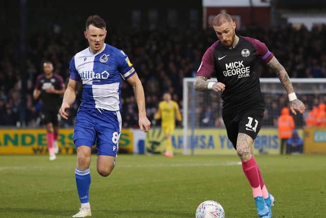 Marcus Maddison (right) in action for Posh.