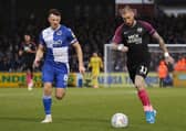 Marcus Maddison (right) in action for Posh.