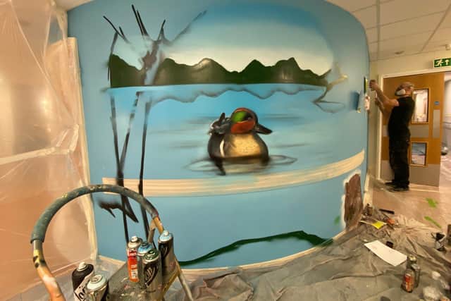A mural being created