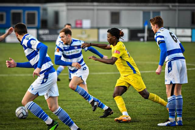 Maniche Sani (blue) in action in the FA Trophy game at Oxford City. Photo: James Richardson.