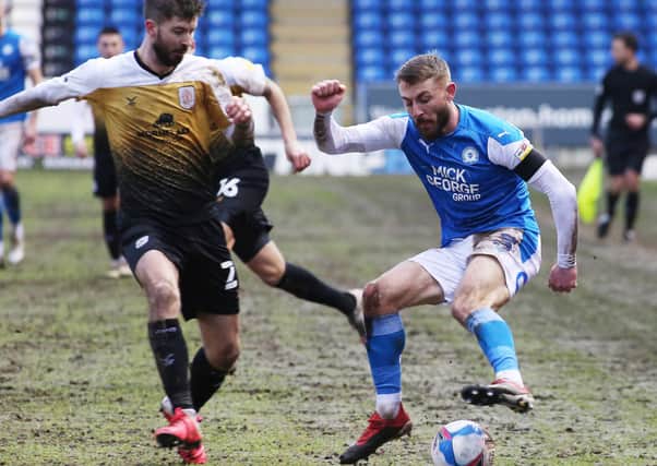 Dan Butler of Peterborough United takes on Luke Murphy of Crewe Alexandra, Photo: Joe Dent/theposh.com.