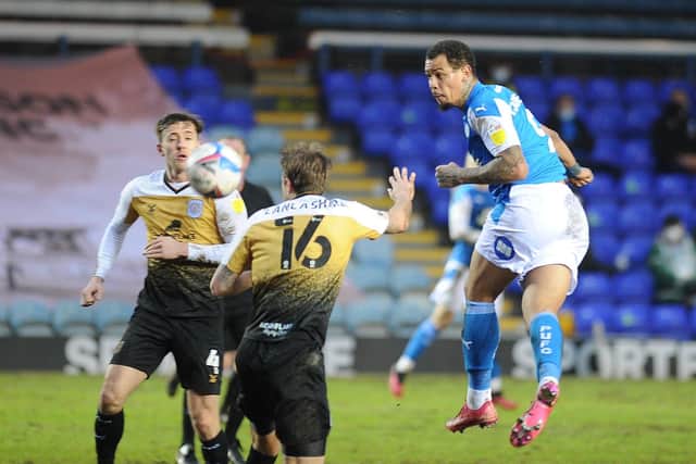 Posh top scorer Jonson Clarke-Harris heads at goal during the 2-0 win against Crewe. Photo: David Lowndes.