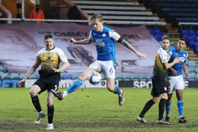 Frankie Kent of Peterborough United in action with Chris Porter of Crewe Alexandra. Photo: Joe Dent/theposh.com