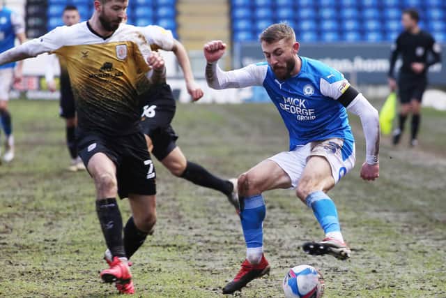 Dan Butler of Peterborough United takes on Luke Murphy of Crewe Alexandra. Photo: Joe Dent/theposh.com.
