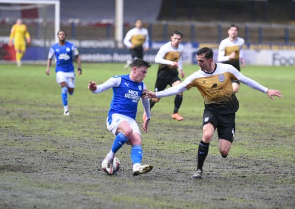 Sammie Szmodics (left) in action for Posh against Crewe. Photo: David Lowndes.