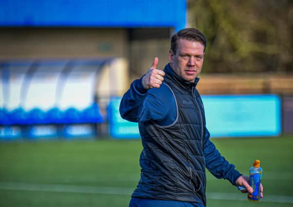 A thumbs up from Peterborough Sports manager Jimmy Dean at Oxford City. Photo: James Richardson.