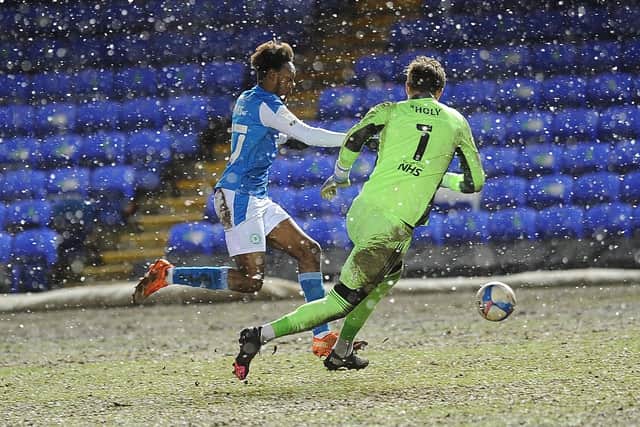 Posh substitute Ricky-Jade Jones against Ipswich goalkeeper Tomas Holy. Photo: David Lowndes.