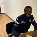 Gaby Zakuani signs on the dotted line again for Spalding United.