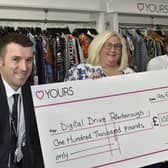 Jonathan Lewis, PCC Director of Education receives a £100,000 cheque for laptops for schools from Yours Clothing founder and CEO Andrew Kiliingsworth  and HR director Kay Clay EMN-210902-123957009