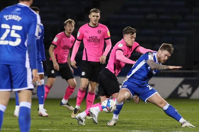 Sammie Szmodics of Peterborough United battles with Callum Slattery of Gillingham. Photo: Joe Dent/theposh.com.