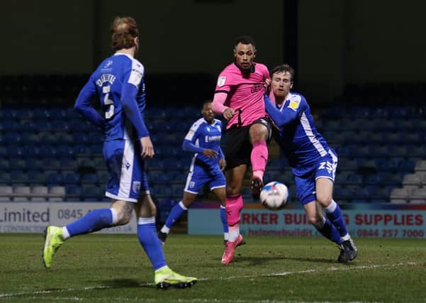 Jonson Clarke-Harris of Peterborough United scores against Gillingham to make it 3-1. Photo: Joe Dent/theposh.com.