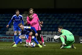 Posh skipper Mark Beevers wanted a penalty for this challenge by Connor Ogilvie. Photo: Joe Dent/theposh.com