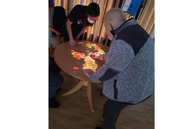 Residents at Longueville Court Care Home enjoy the Magic Table 360. Residents at Longueville Court Care Home enjoy the Magic Table 360.