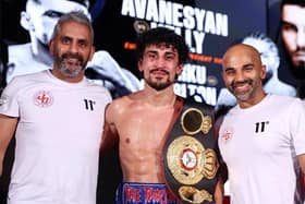 Jordan Gill with his father Paul Gill (left) and trainer David Coldwell and the WBA Internanational Featherweight belt after a points win over Cesar Juarez. Photo: Mark Robinson/Matchroom Boxing.