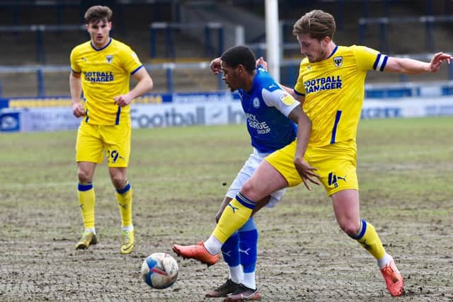 Reece Brown in action for Posh against Wimbledon. Photo; David Lowndes.