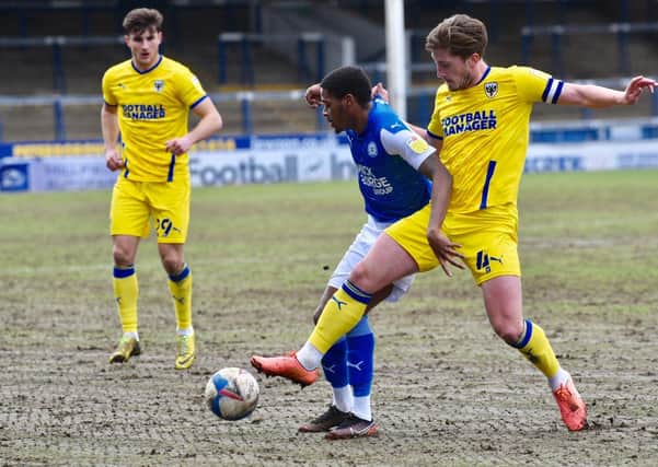 Reece Brown in action for Posh against Wimbledon. Photo; David Lowndes.