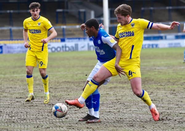 Posh midfielder Reece Brown (blue) is fit and could play at Plymouth. Photo: David Lowndes.