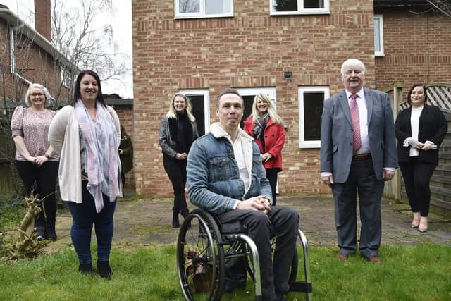 Kerry Aldred, Steve Marsh and Ged Dempsey with volunteers from the Supported Housing Fellowship, The Three Pillars and the Cold Feet Campaign at the opening of the new supporting housing residence at Birchtree Avenue, Dogsthorpe.