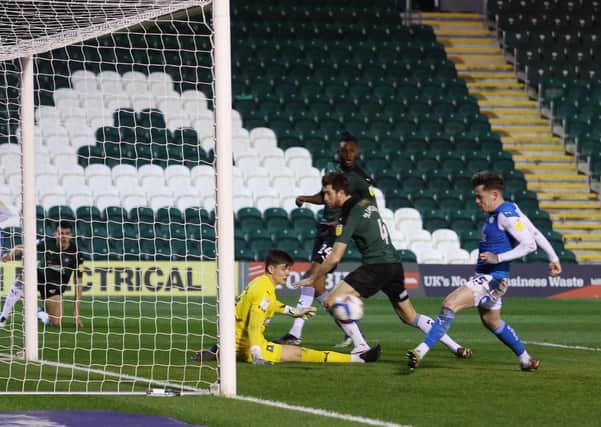 Sammie Szmodics of Peterborough United scores the opening goal of the game against Plymouth Argyle. Photo: Joe Dent/theposh.com.